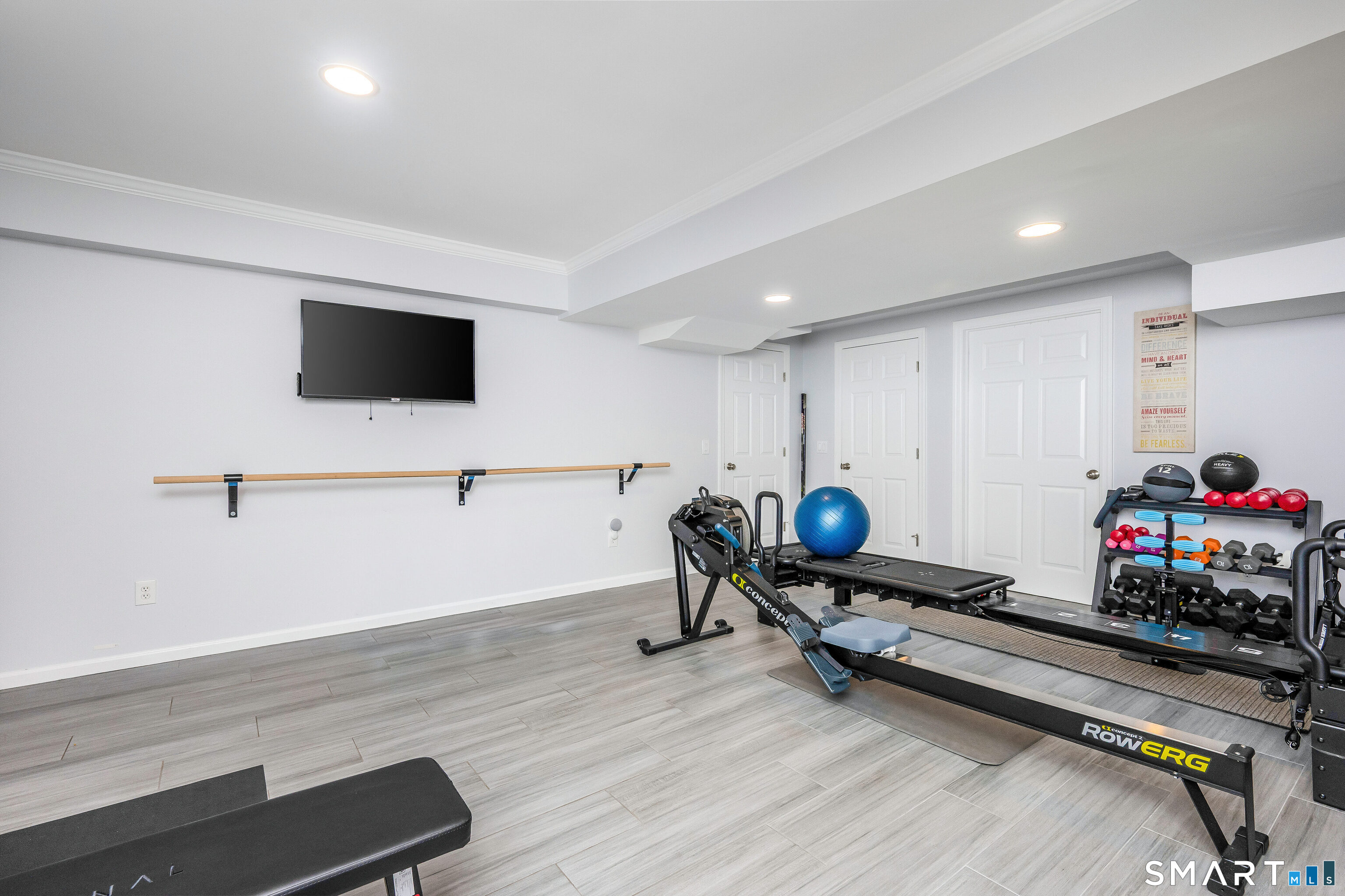 34 Intervale Road Darien, CT 06820 - Photo 26 of 36 a living room with furniture and a flat screen tv