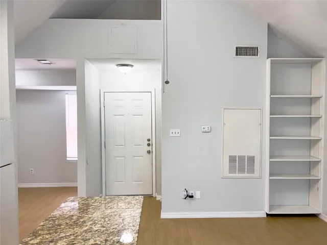 a bathroom with a tub and shower