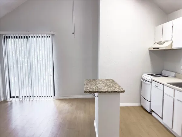 an entryway with wooden floor