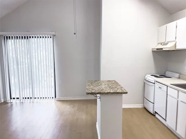 an entryway with wooden floor