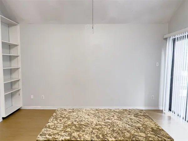 a view of an empty room and window