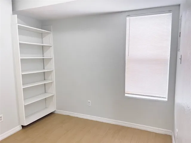 a view of a room that has a window