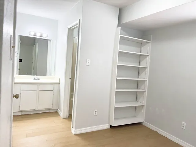 a view of cabinets and window