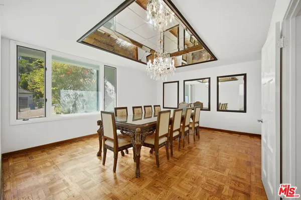 a large white kitchen with a large window