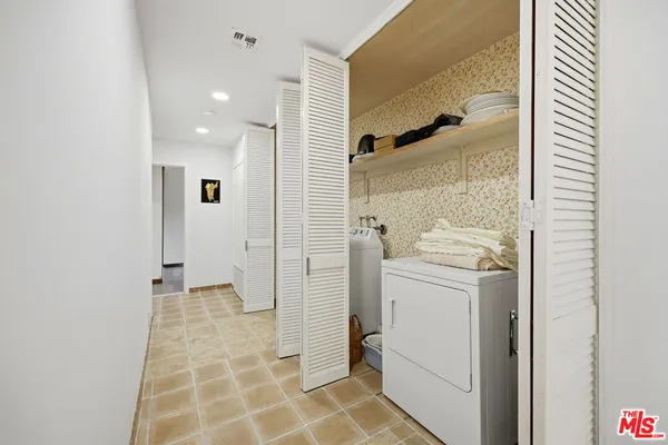 an empty room with sliding door and mountain view
