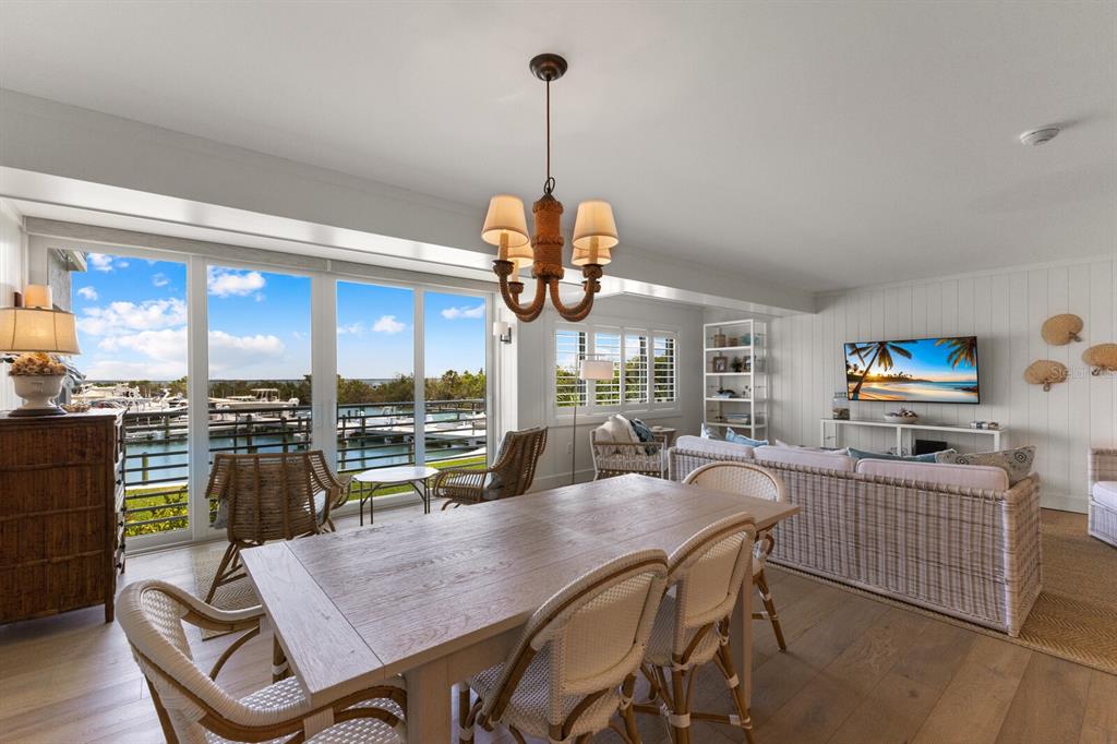 5850 Gasparilla Road, Unit M1&3 Boca Grande, FL 33921 - Photo 12 of 57 a view of a dining room with furniture window and outside view