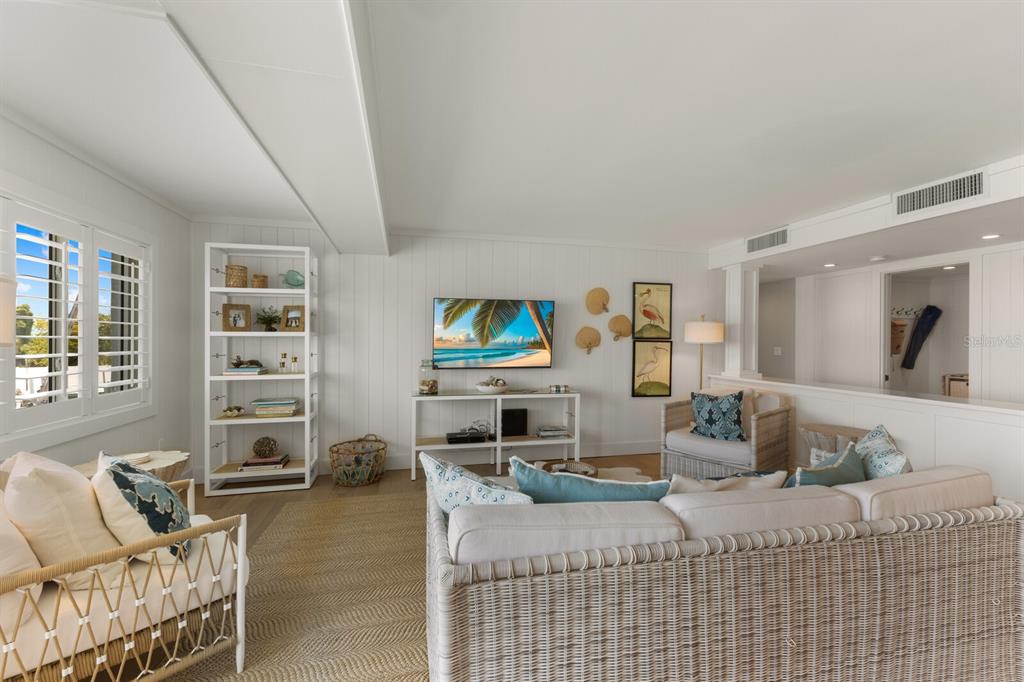 5850 Gasparilla Road, Unit M1&3 Boca Grande, FL 33921 - Photo 17 of 57 a living room with furniture and a flat screen tv