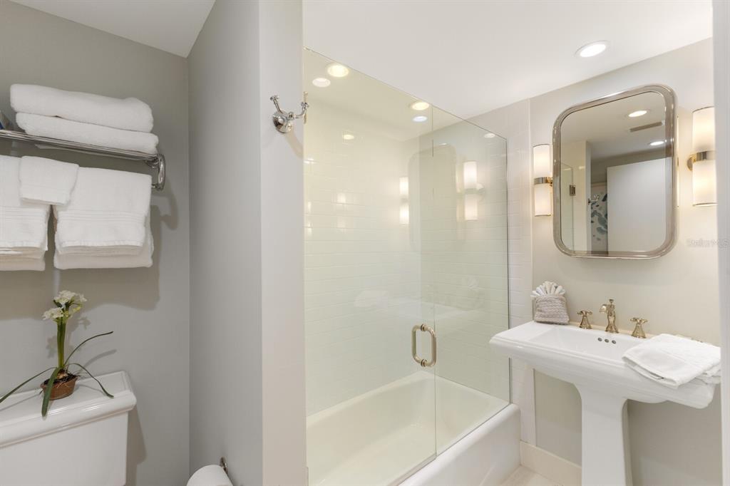 5850 Gasparilla Road, Unit M1&3 Boca Grande, FL 33921 - Photo 26 of 57 a bathroom with a bathtub sink mirror and toilet