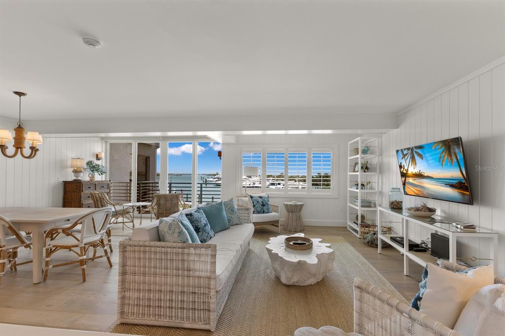 5850 Gasparilla Road, Unit M1&3 Boca Grande, FL 33921 - Photo 3 of 57 a living room with furniture and a flat screen tv