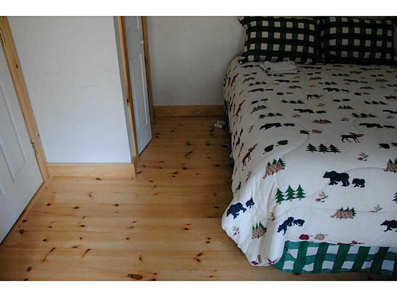 1008 Round House Road Carrabassett Valley, ME 04947 - Photo 7 of 27 Master Bedroom. Flooring in Master...