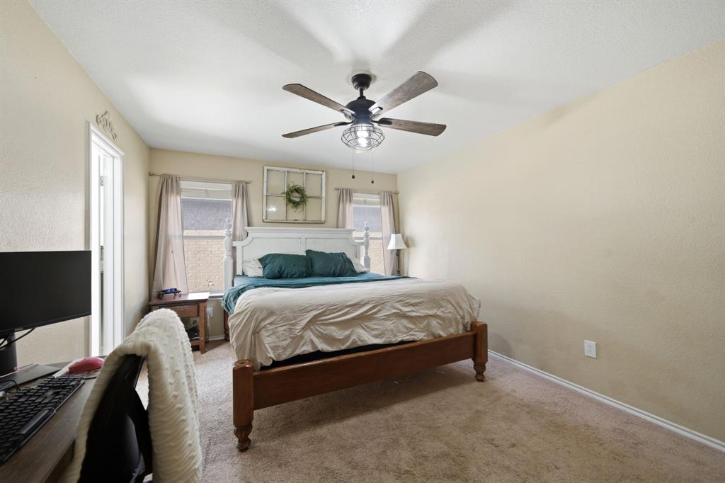 2008 Times Road Heartland, TX 75126 - Photo 17 of 28 a bedroom with a bed and a flat screen tv
