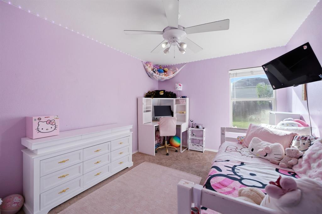2008 Times Road Heartland, TX 75126 - Photo 20 of 28 a living room with furniture and a flat screen tv