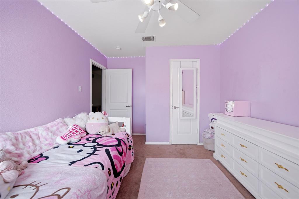 2008 Times Road Heartland, TX 75126 - Photo 21 of 28 a bedroom with a bed and a dresser