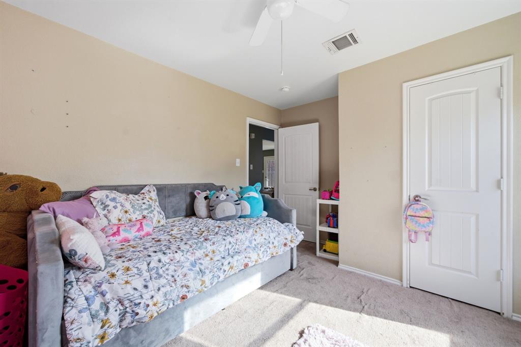 2008 Times Road Heartland, TX 75126 - Photo 22 of 28 a bedroom with a bed and a window
