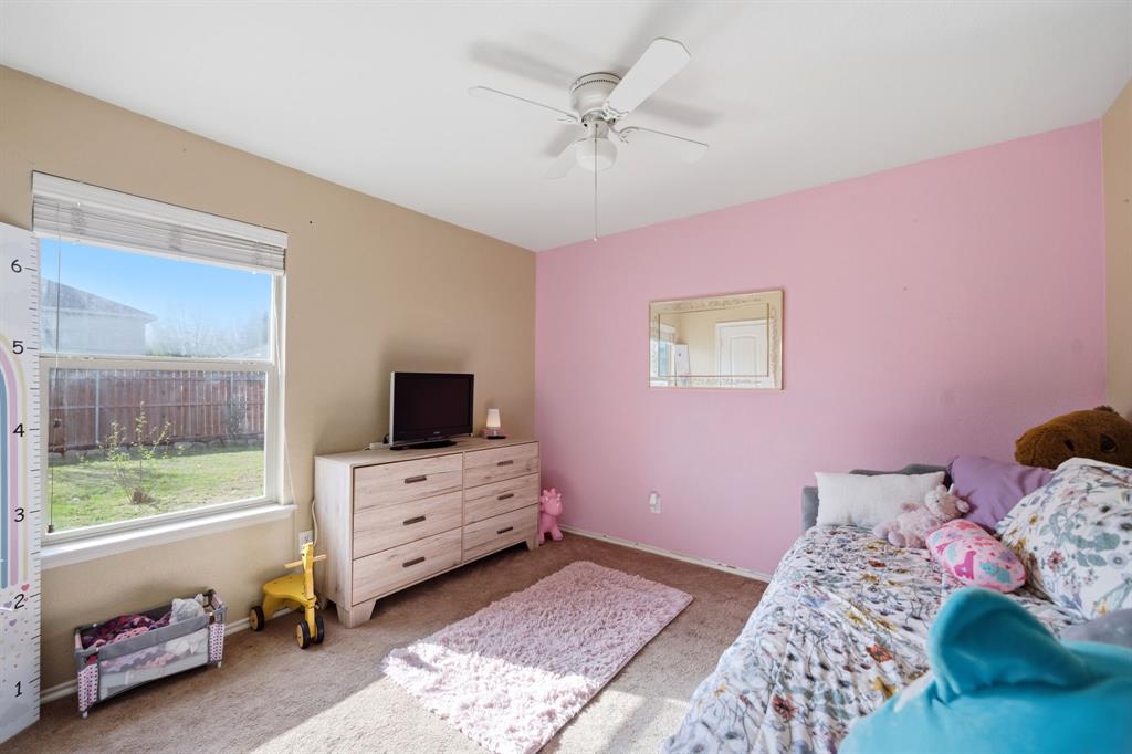 2008 Times Road Heartland, TX 75126 - Photo 23 of 28 a bedroom with a bed and a tv
