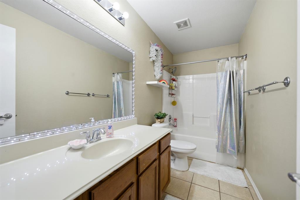2008 Times Road Heartland, TX 75126 - Photo 24 of 28 a bathroom with a sink a toilet and shower