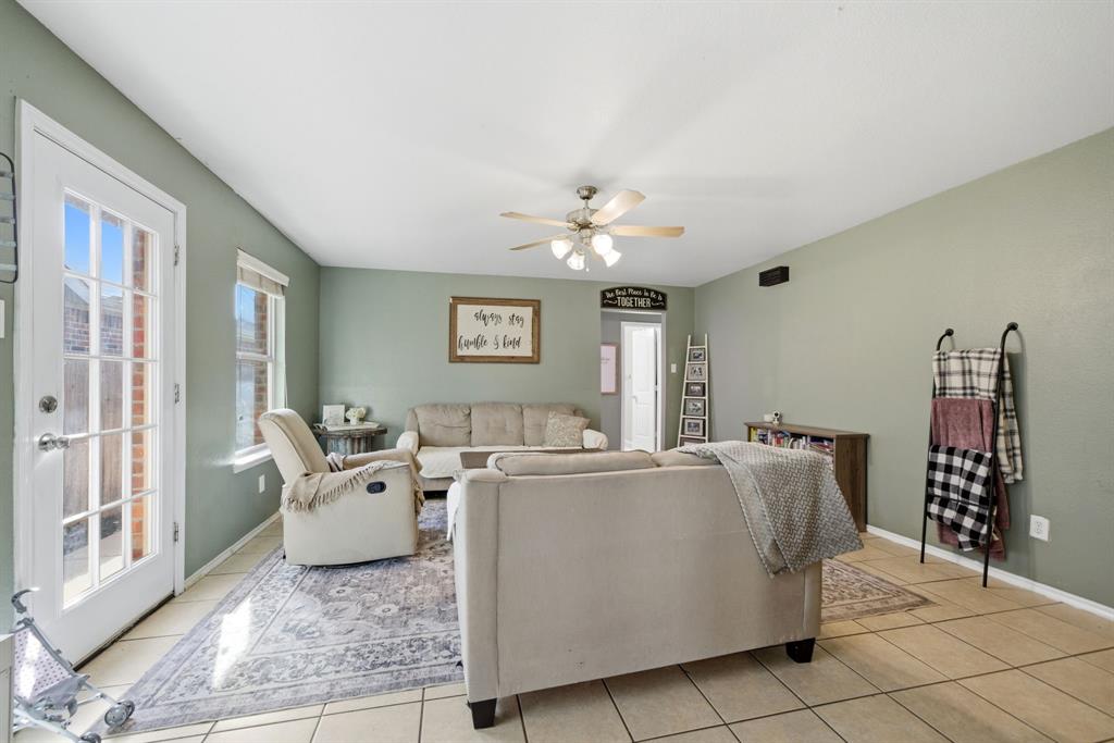 2008 Times Road Heartland, TX 75126 - Photo 8 of 28 a living room with furniture and chandelier
