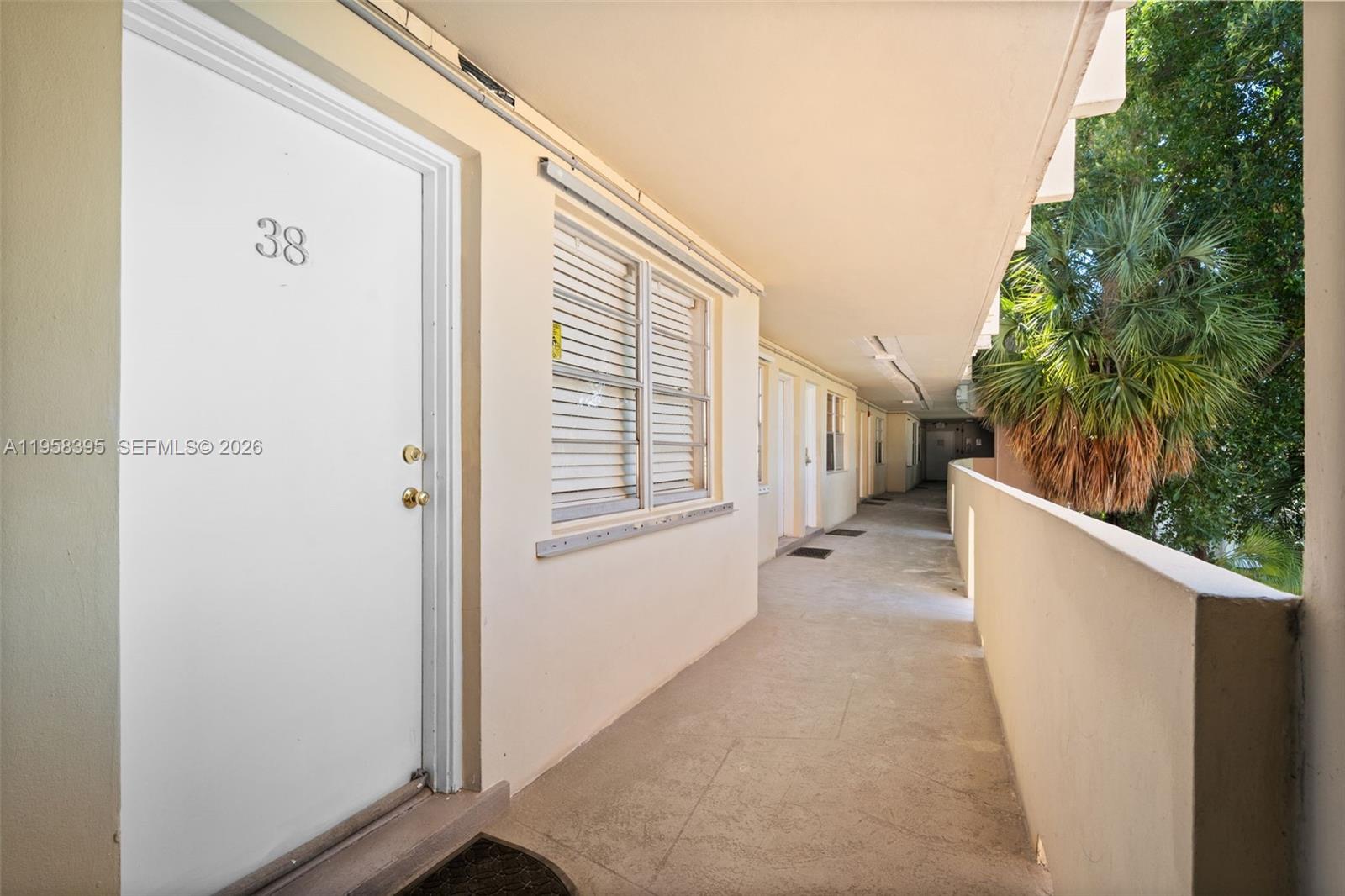 4011 Meridian Avenue, Unit 38 Miami Beach, FL 33140 - Photo 13 of 22 a view of a house with backyard and trees