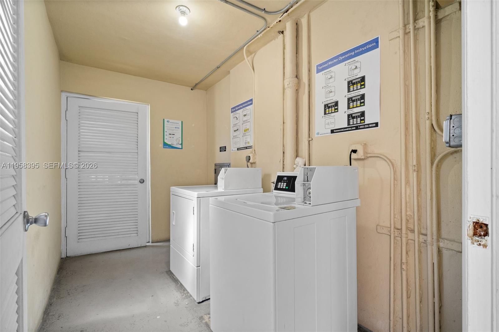 4011 Meridian Avenue, Unit 38 Miami Beach, FL 33140 - Photo 14 of 22 a utility room with dryer and washer