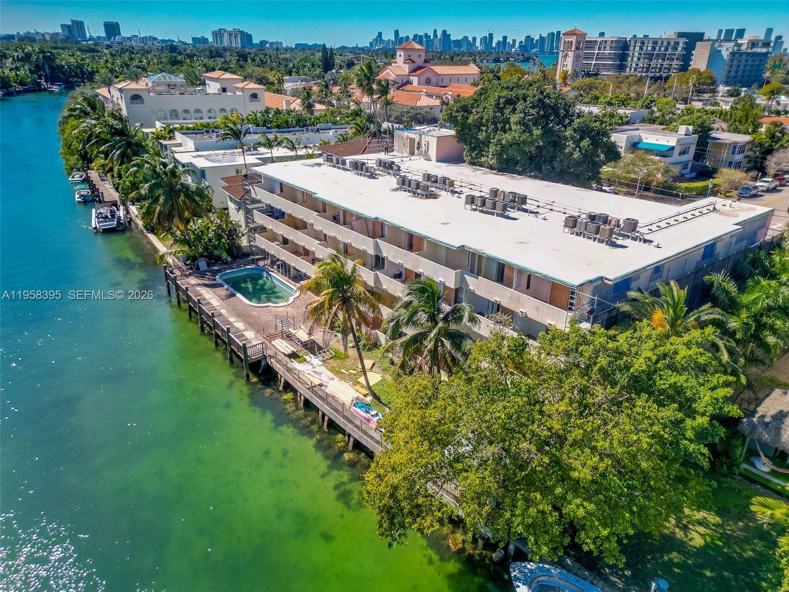 4011 Meridian Avenue, Unit 38 Miami Beach, FL 33140 - Photo 16 of 22 aerial view of a house with a garden and lake view