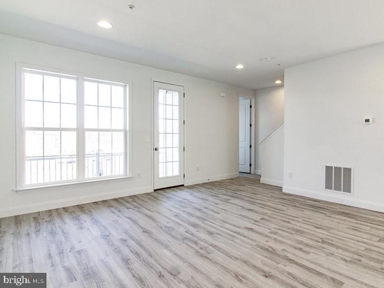 3228 Light Way Mechanicsburg, PA 17055 - Photo 12 of 33 a view of empty room with wooden floor and fan