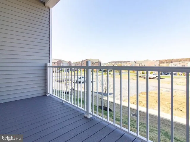 a view of a balcony with wooden floor