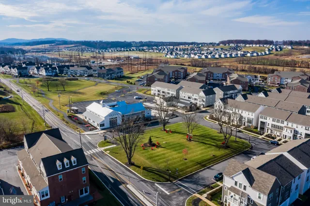 an aerial view of a residential building with outdoor space