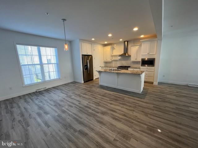 3228 Light Way Mechanicsburg, PA 17055 - Photo 5 of 33 a view of kitchen with kitchen island wooden floor center island and stainless steel appliances