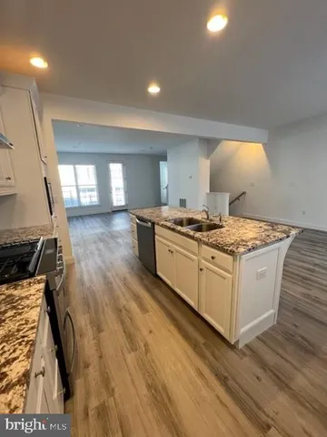 a kitchen that has a sink and a stove