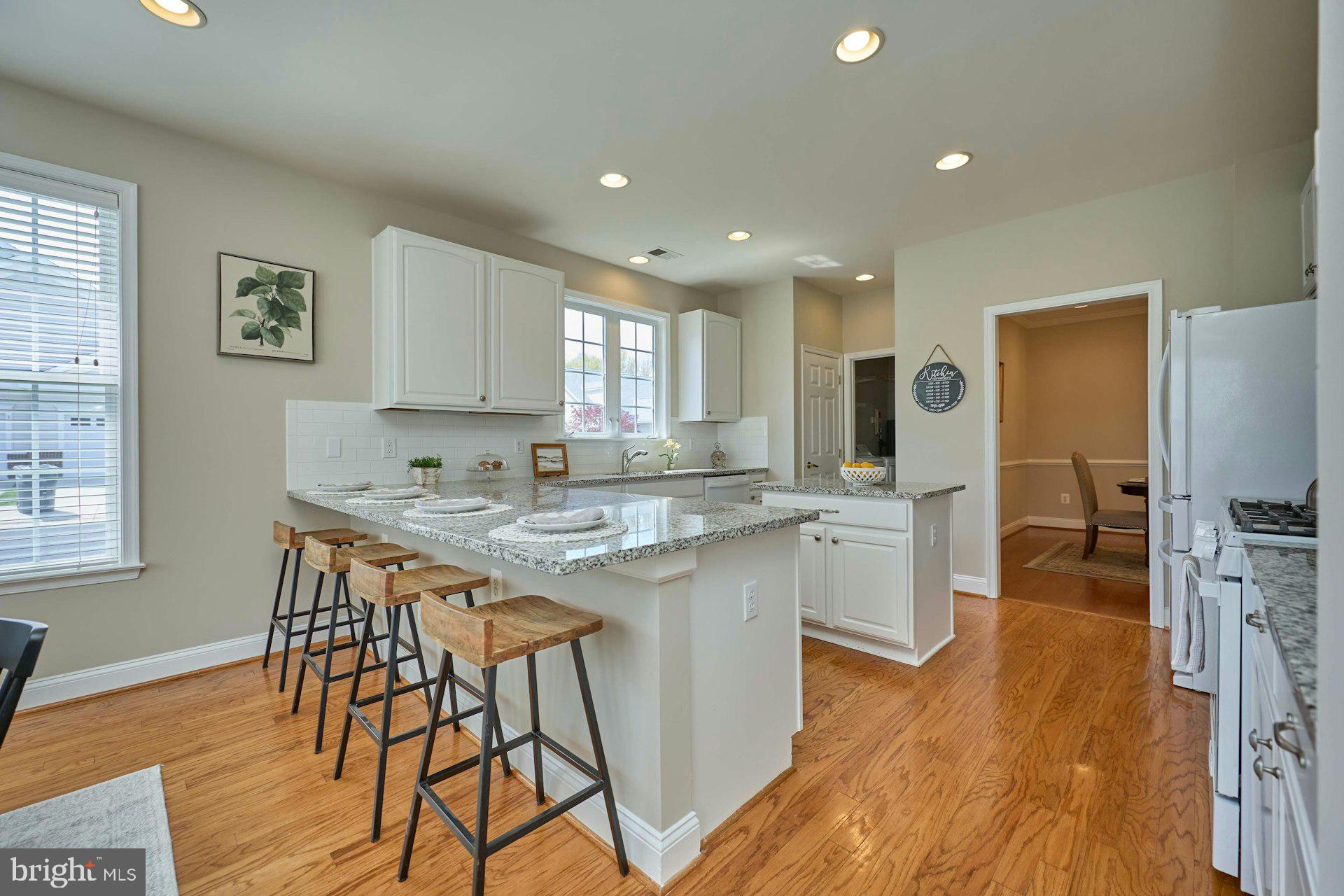 6907 Broadleaf Terrace Gainesville, VA 20155 - Photo 16 of 54 Counter Seating at Center Island, Recessed lights