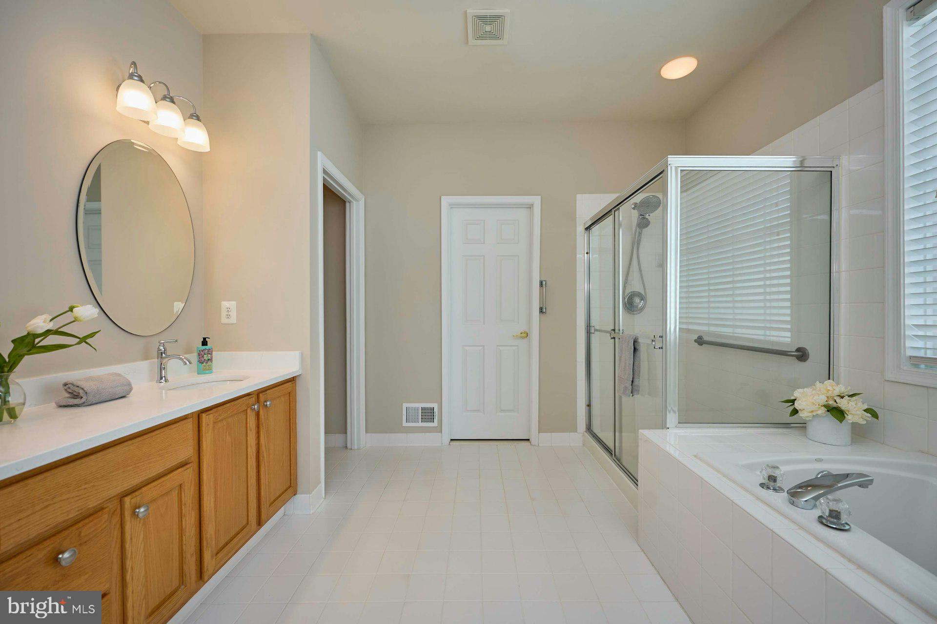 6907 Broadleaf Terrace Gainesville, VA 20155 - Photo 27 of 54 Primary Bathroom w/ceramic tile & double sinks