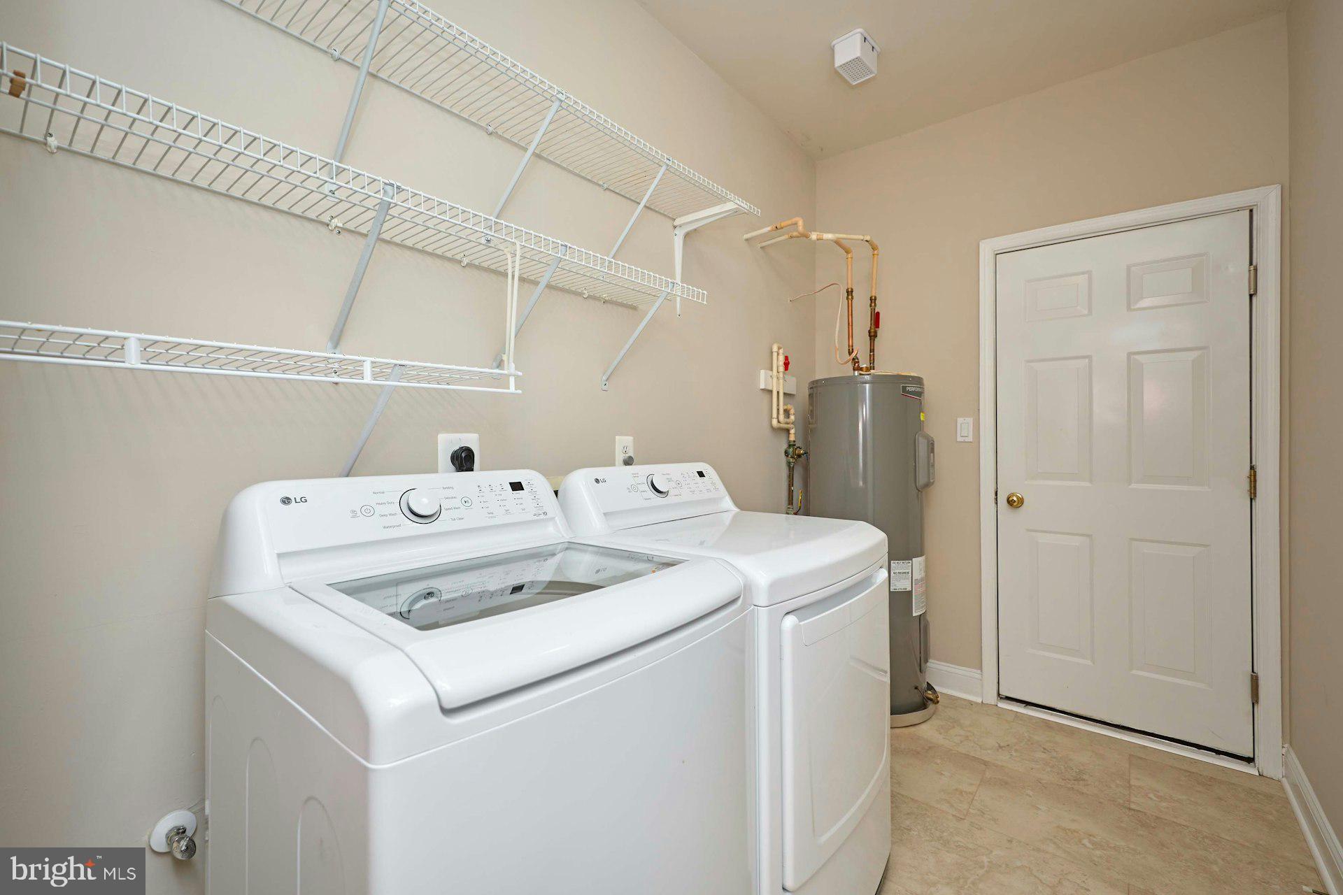6907 Broadleaf Terrace Gainesville, VA 20155 - Photo 34 of 54 Laundry Room Leading to Garage w/new LVP