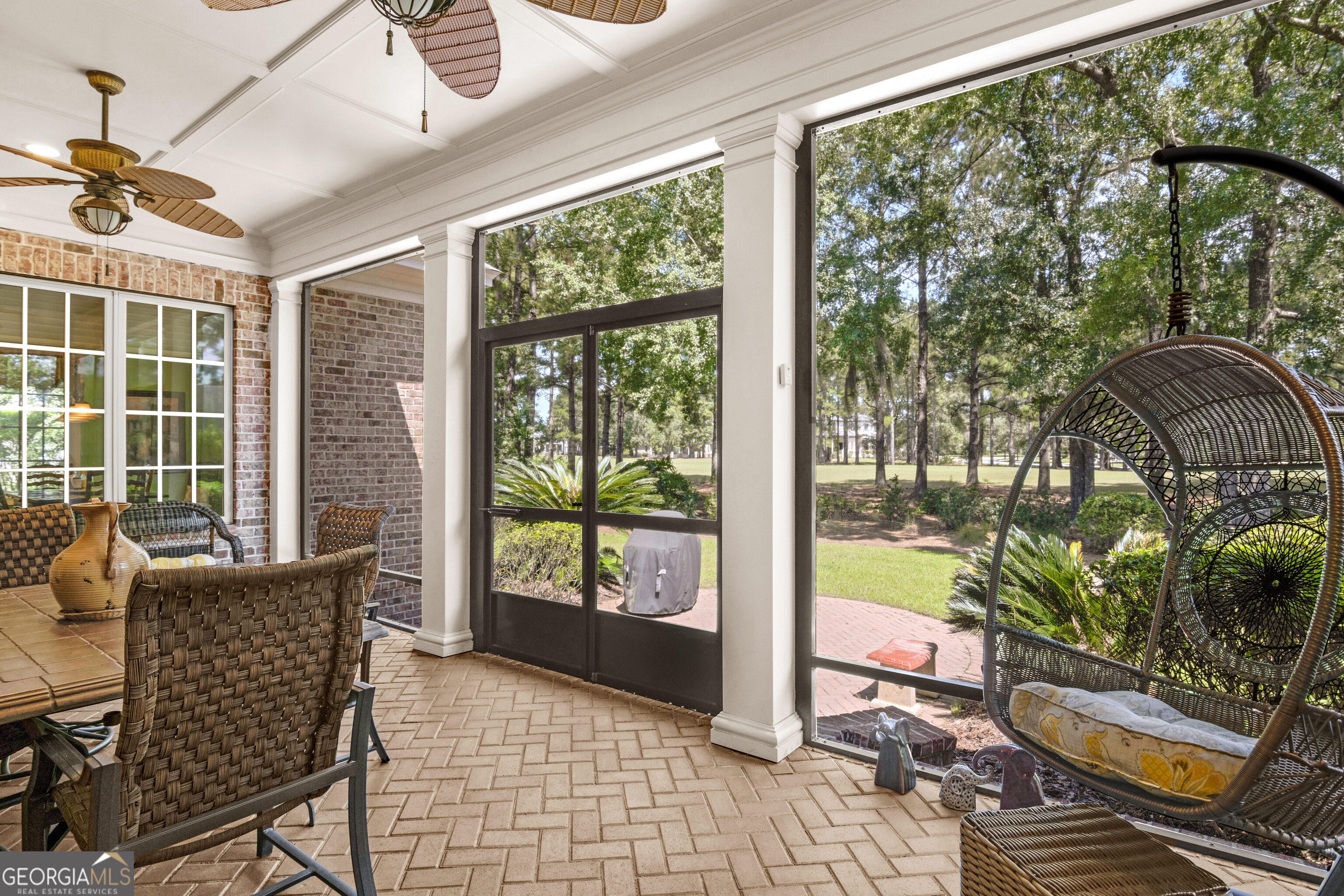 312 Spanton Crescent Pooler, GA 31322 - Photo 21 of 62 a living room with patio furniture and a floor to ceiling window