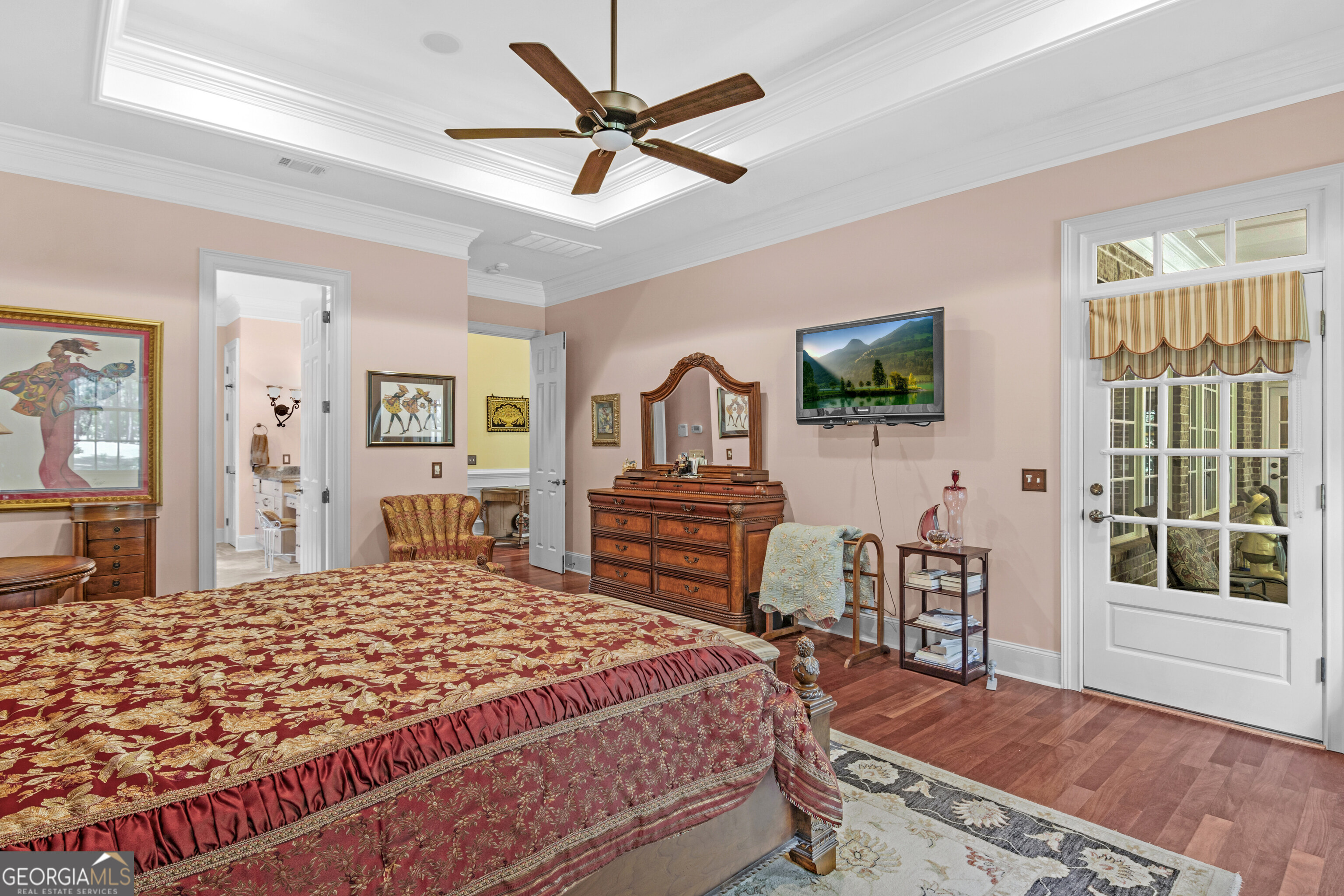 312 Spanton Crescent Pooler, GA 31322 - Photo 24 of 62 a bedroom with a bed and dresser with wooden floor