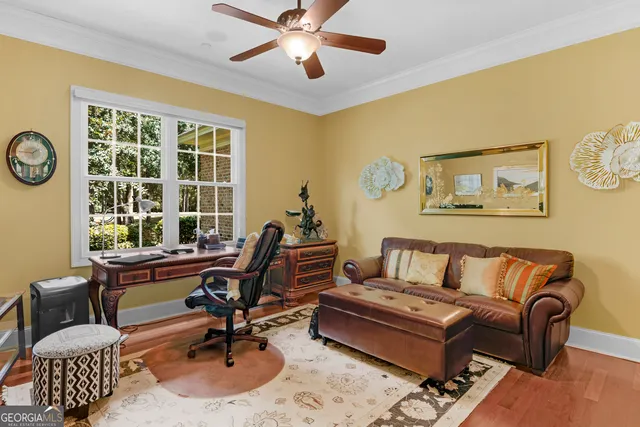 a view of a house with a yard and sitting space