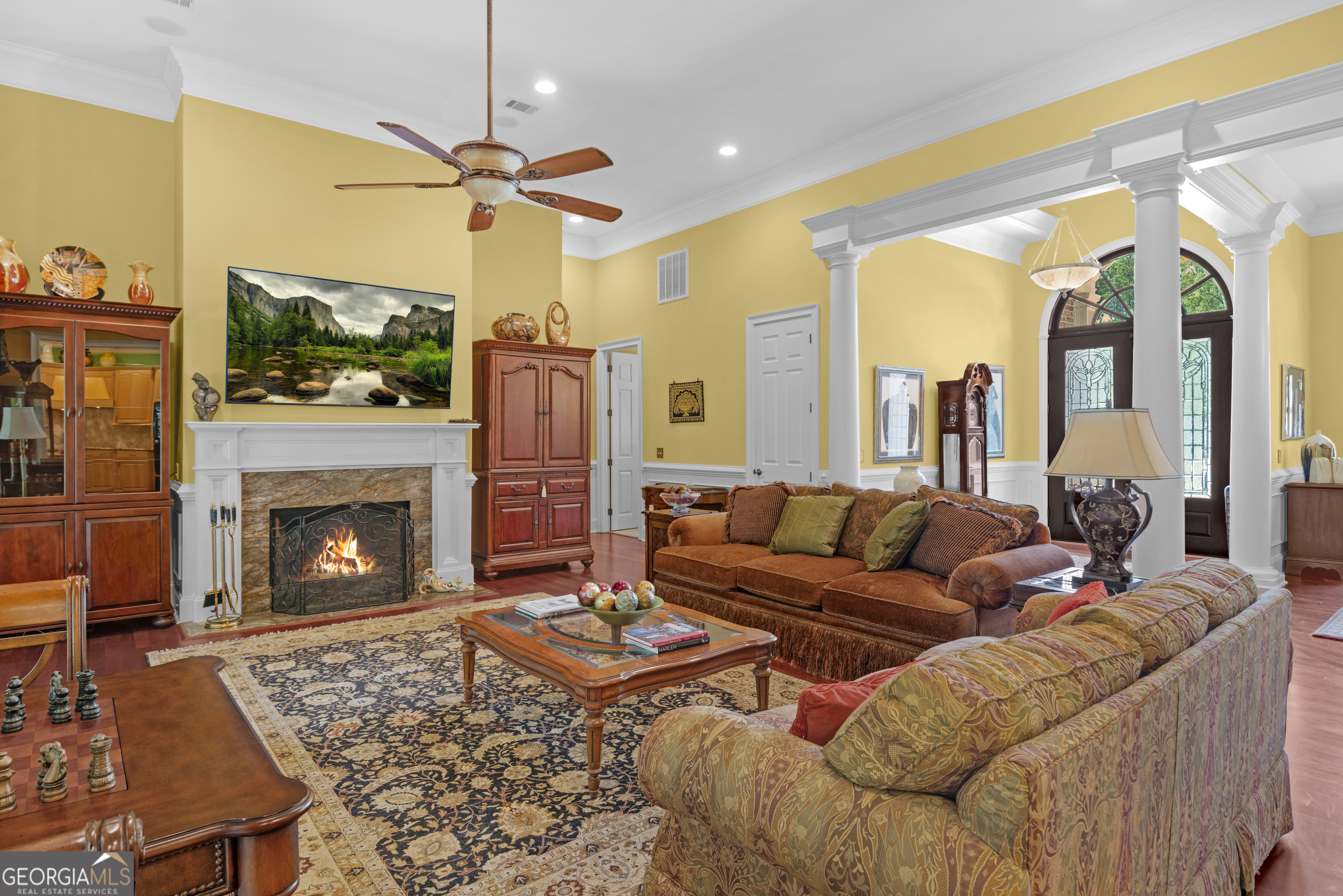 312 Spanton Crescent Pooler, GA 31322 - Photo 5 of 62 a living room with furniture a flat screen tv and a fireplace