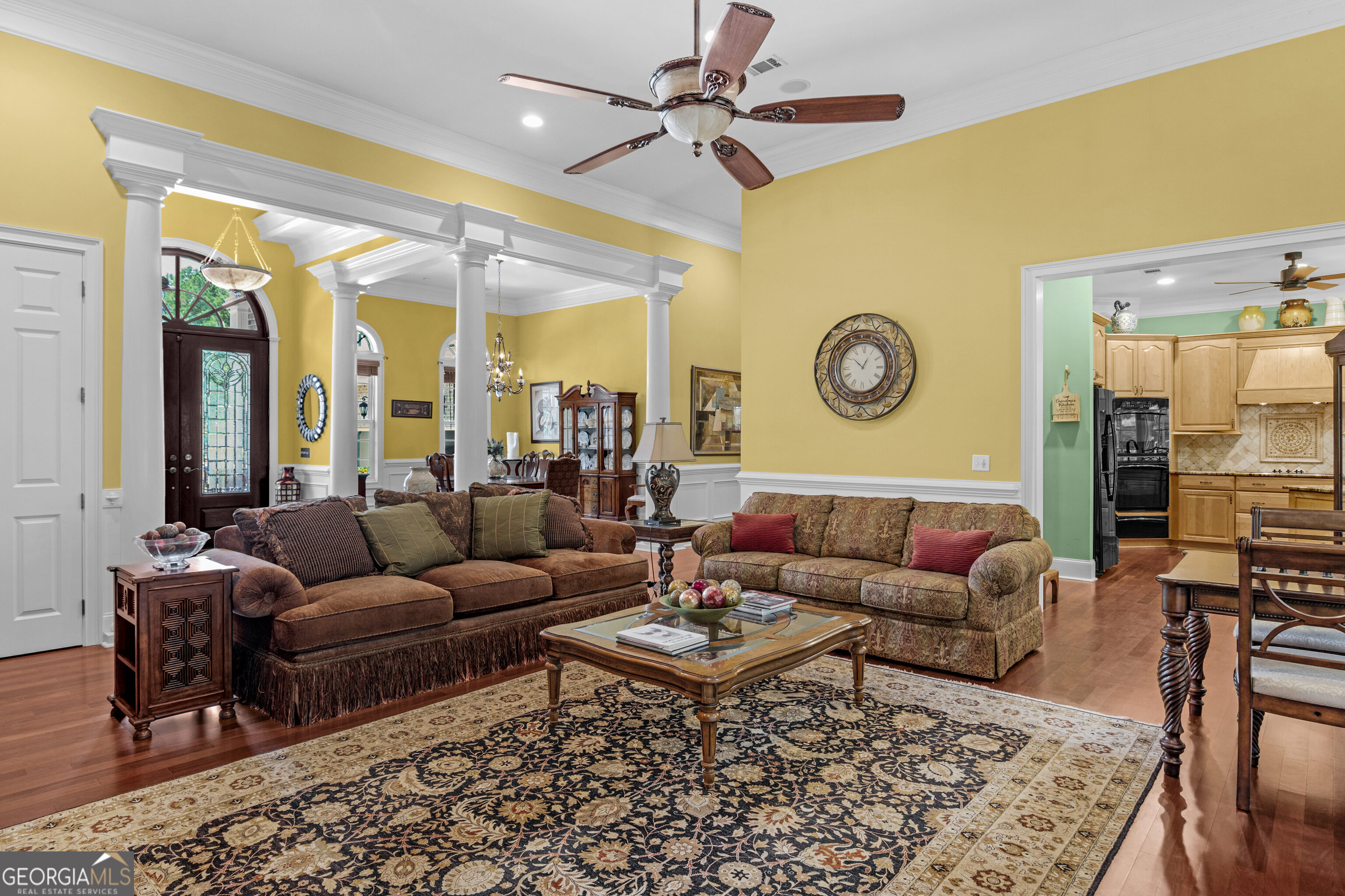 312 Spanton Crescent Pooler, GA 31322 - Photo 6 of 62 a living room with furniture a rug and a chandelier