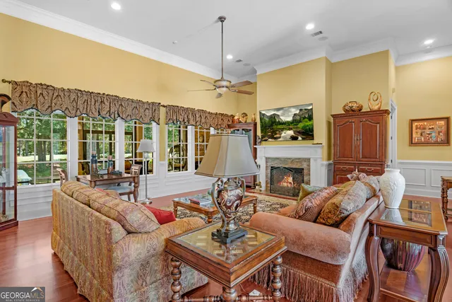 a view of a dining room with furniture and a chandelier