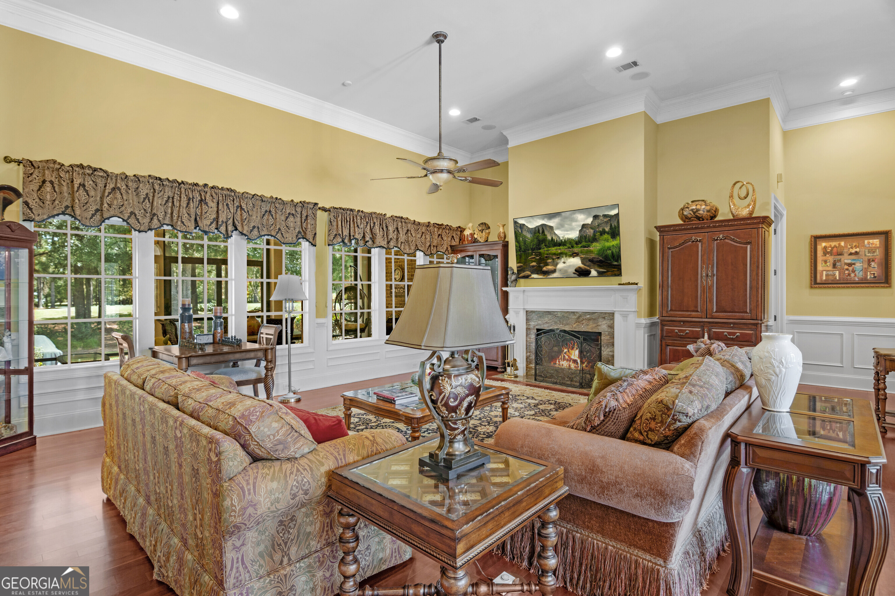 312 Spanton Crescent Pooler, GA 31322 - Photo 7 of 62 a living room with furniture a fireplace and a chandelier