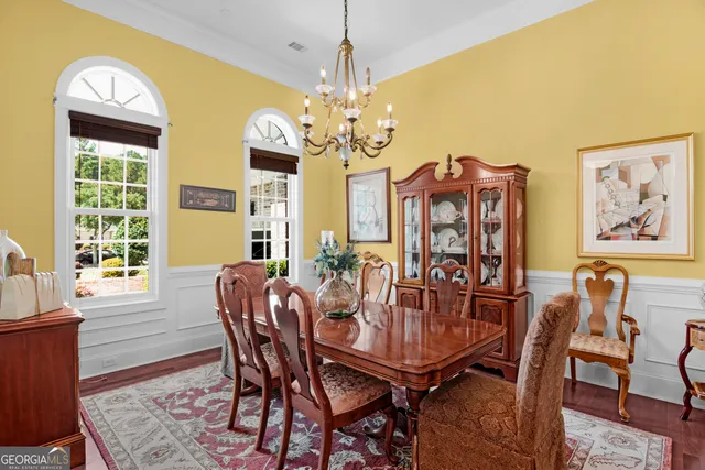 a kitchen with granite countertop a refrigerator and a sink