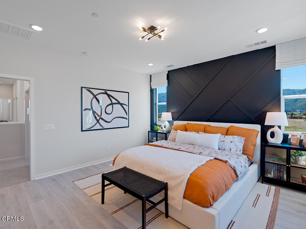 3822 Silvergrass Lane Piru, CA 93040 - Photo 13 of 24 a bedroom with a bed and wooden floor