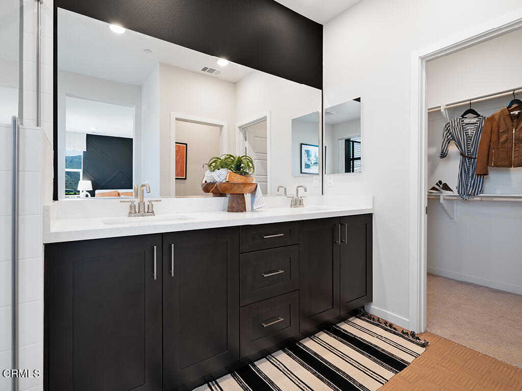 3822 Silvergrass Lane Piru, CA 93040 - Photo 16 of 24 a bathroom with a sink double vanity and a mirror