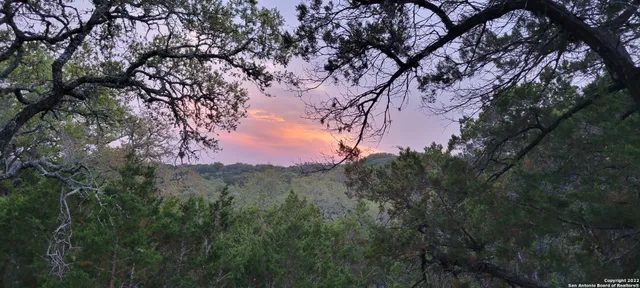 a view of mountain view with lots of trees