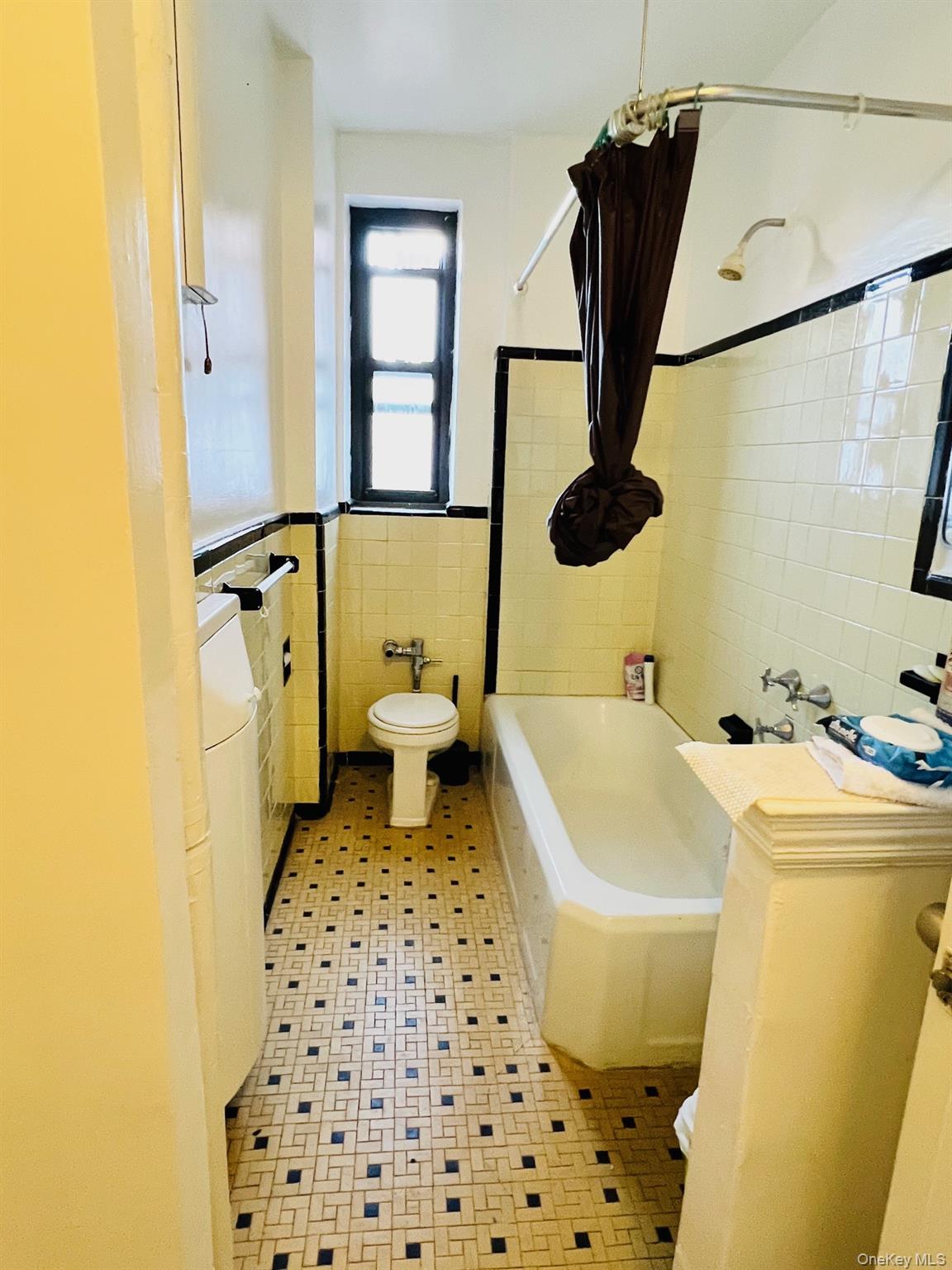 67-35 Yellowstone Boulevard, Unit 7E Queens, NY 11375 - Photo 15 of 16 a bathroom with a sink toilet and shower