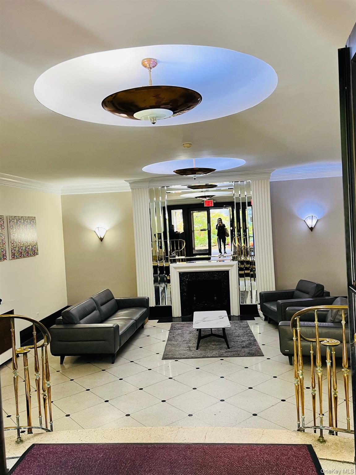 67-35 Yellowstone Boulevard, Unit 7E Queens, NY 11375 - Photo 3 of 16 a living room with a couch and a ceiling fan