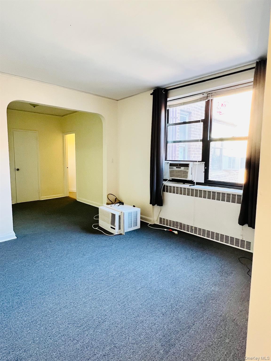 67-35 Yellowstone Boulevard, Unit 7E Queens, NY 11375 - Photo 8 of 16 a view of a room with large window