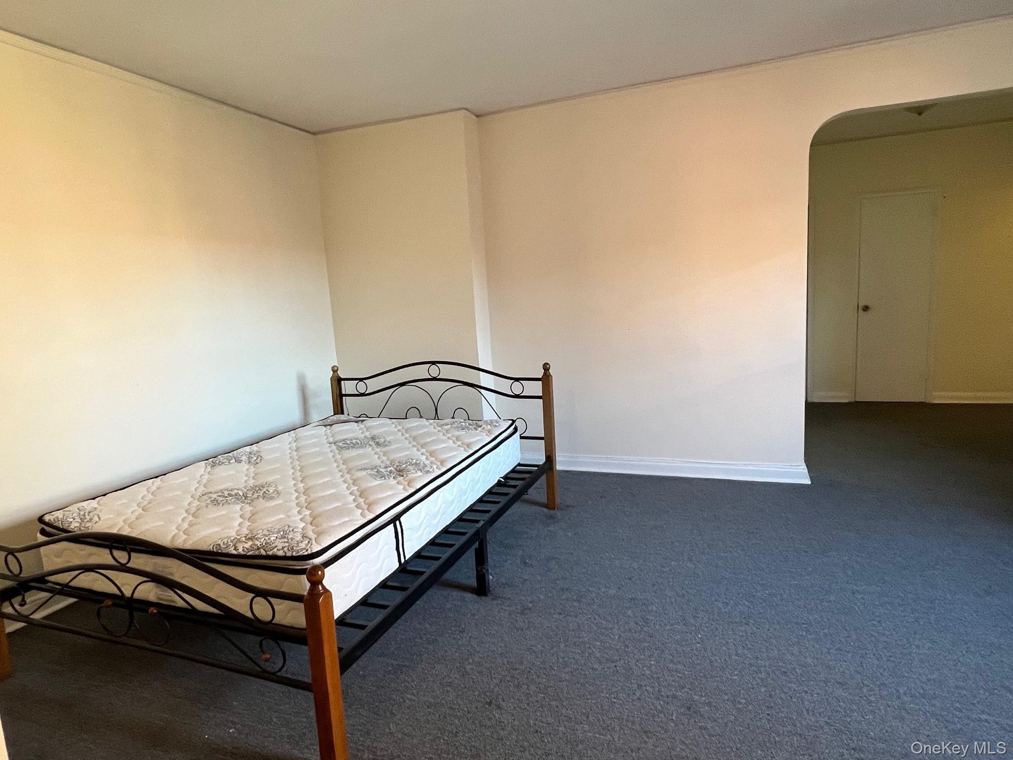 67-35 Yellowstone Boulevard, Unit 7E Queens, NY 11375 - Photo 9 of 16 a room with a table and wooden floor