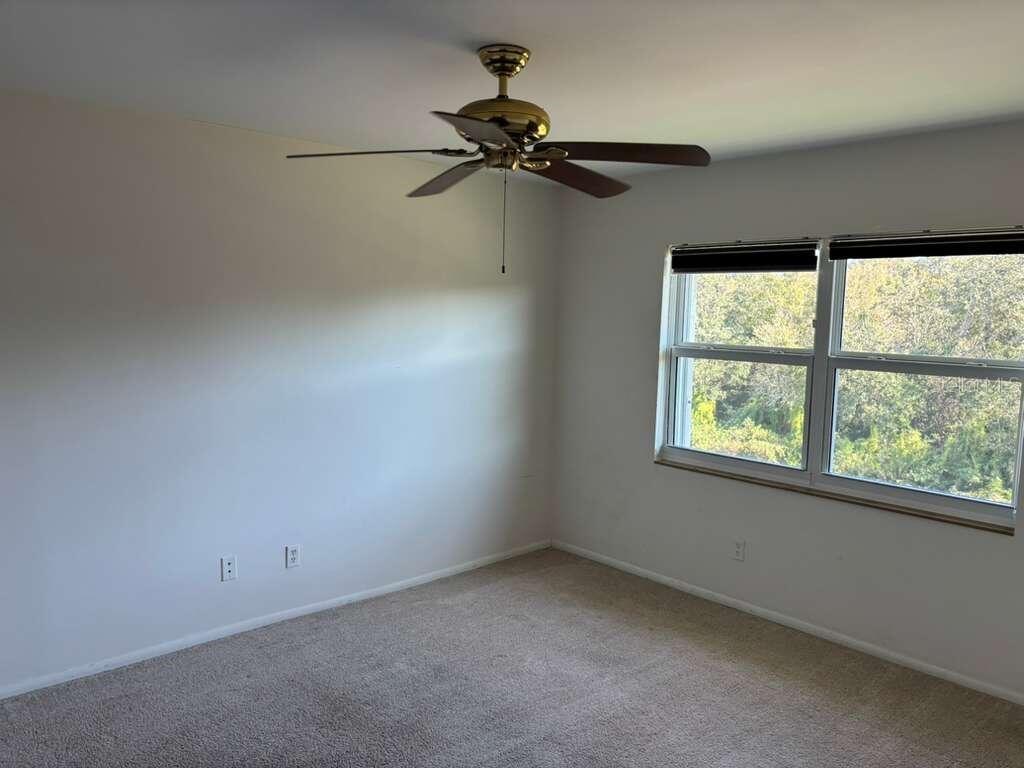 26485 Rampart Boulevard, Unit A27 Punta Gorda, FL 33983 - Photo 13 of 19 an empty room with a window