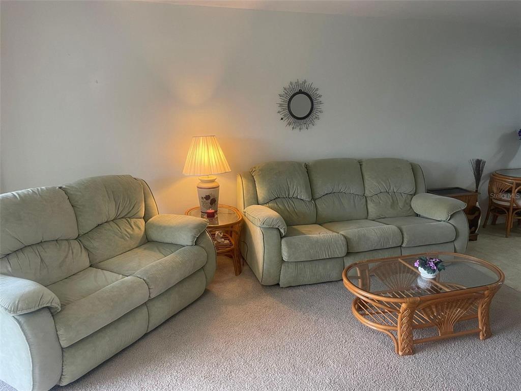 26485 Rampart Boulevard, Unit A27 Punta Gorda, FL 33983 - Photo 4 of 19 a living room with furniture