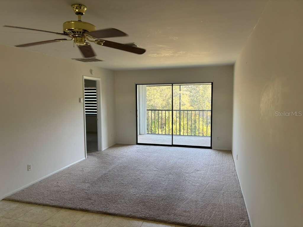 26485 Rampart Boulevard, Unit A27 Punta Gorda, FL 33983 - Photo 9 of 19 a view of a livingroom with a staircase